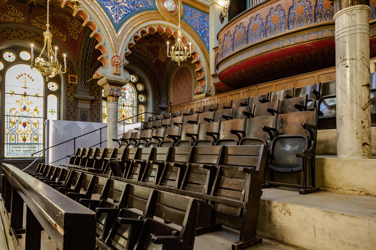 Pews from former Synagogues to replace originals. During Shoah used for furniture storage by Nazis.